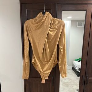 Cross neck body suit